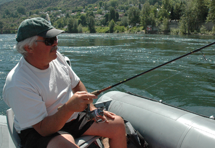 Gary Crombie casts his line into the waters of the Columbia River in Trail, B.C.