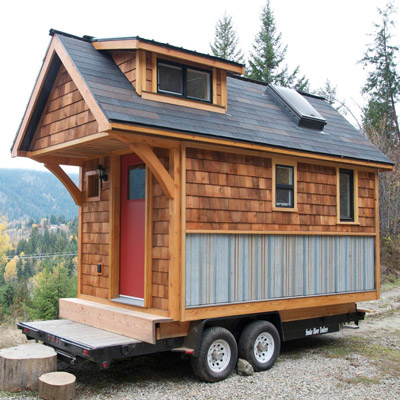 Cute tiny home with cedar siding. 