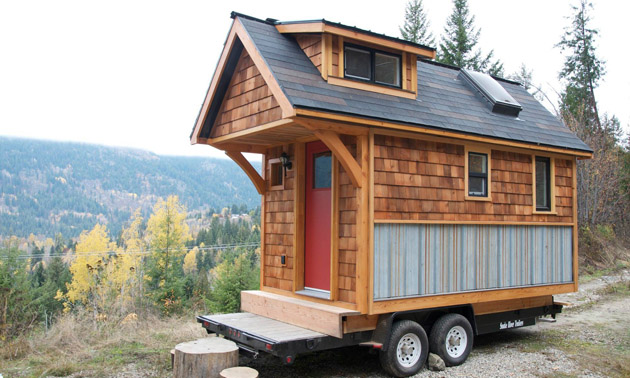 Cute tiny home with cedar siding. 