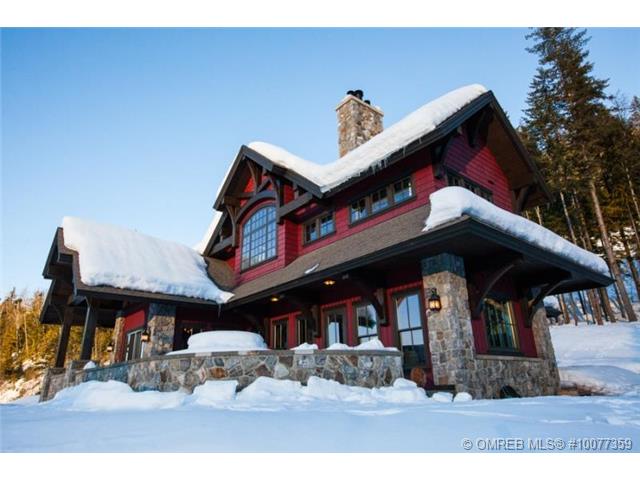 Snow covered luxury estate home offered at Revelstoke Mountain Resort.