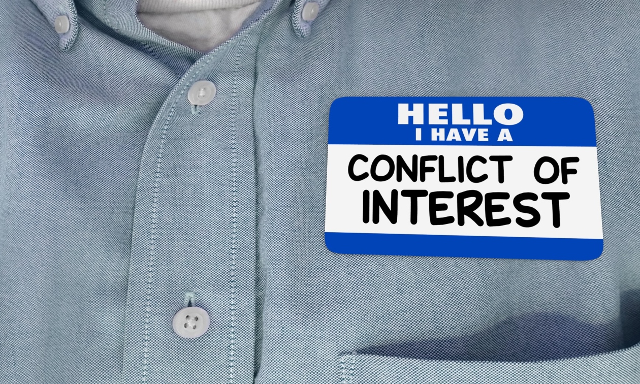 Closeup of a nametag on a shirt, that says 