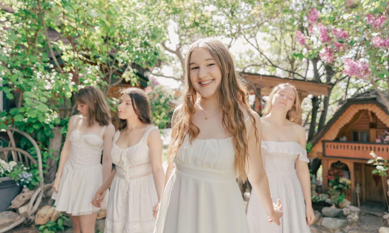 Nicole standing in the foreground with other young women standing behind her
