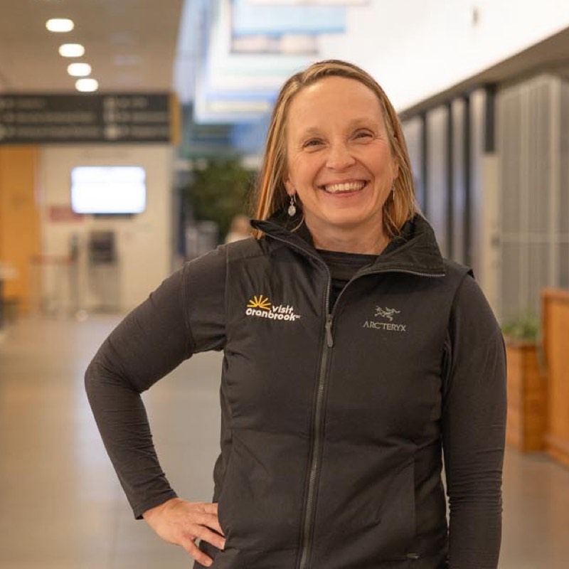 Kristy Jahn Smith standing in a hallway with her hand on her hip