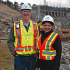 Photo of a man and woman in front of Waneta dam
