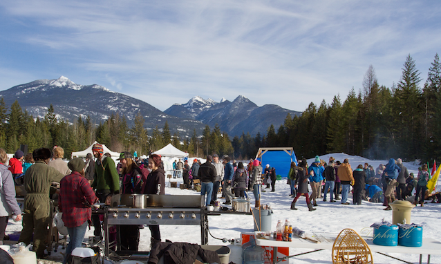 people at the winter festival barbecuing hotdogs