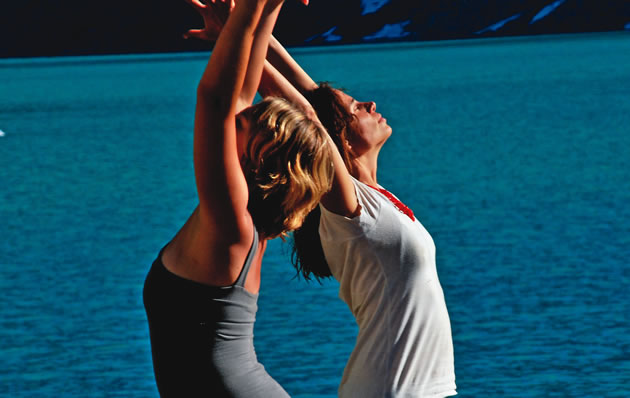 Photo of two women doing yoga