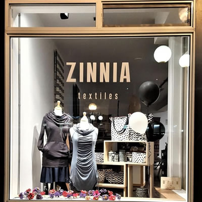 A picture of the window of Zinnia Textiles. 